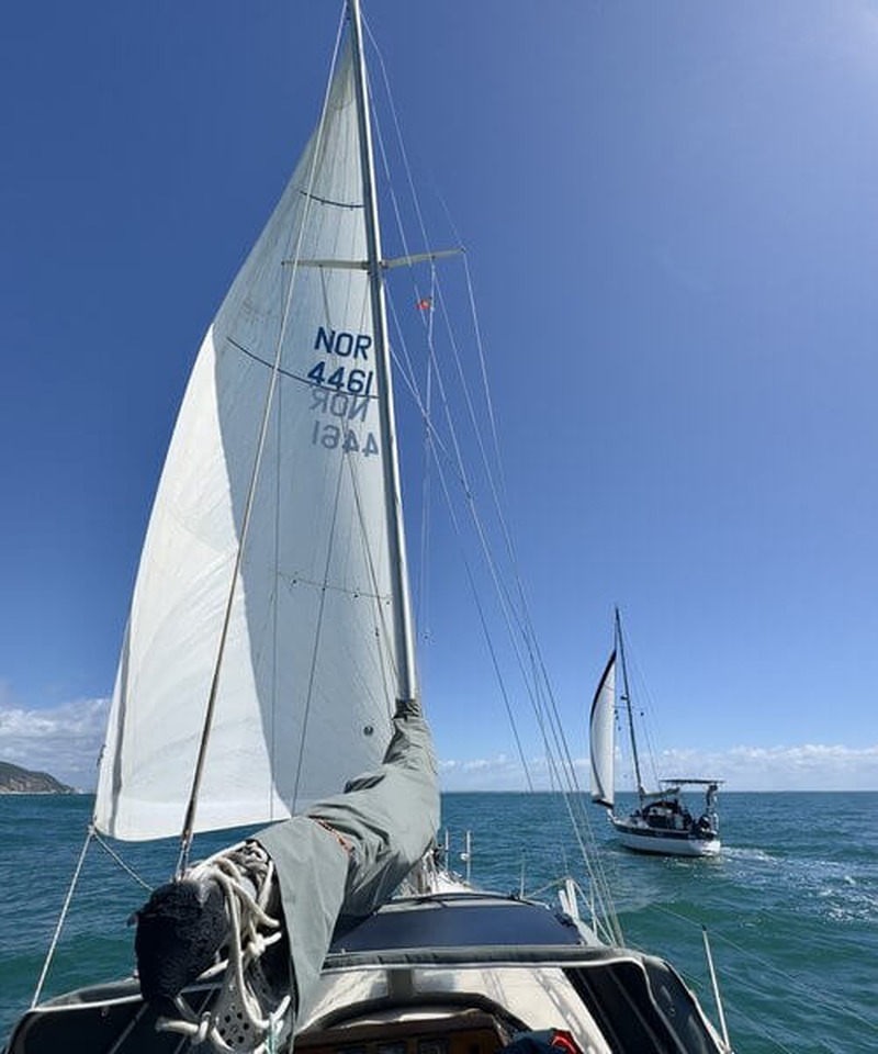 Sailing yacht with billowing mainsail