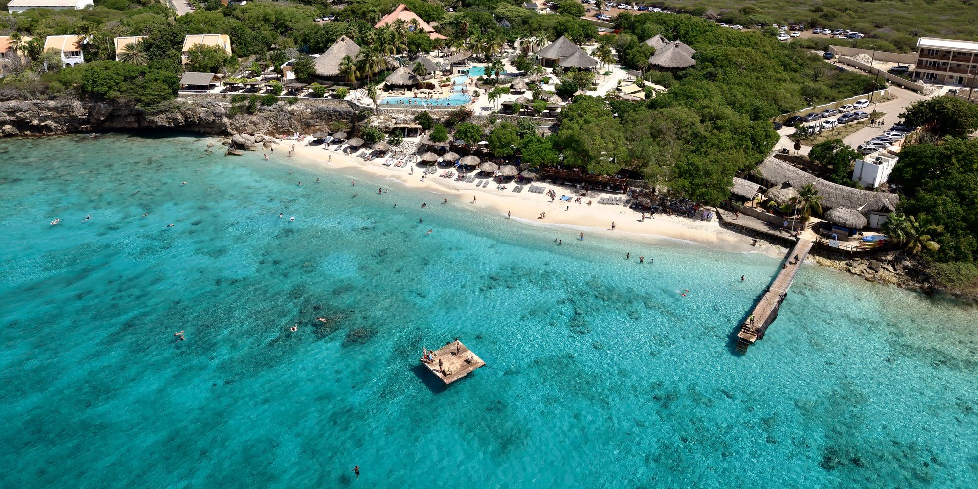 Aerial view of a Curacao bay, reef and beach